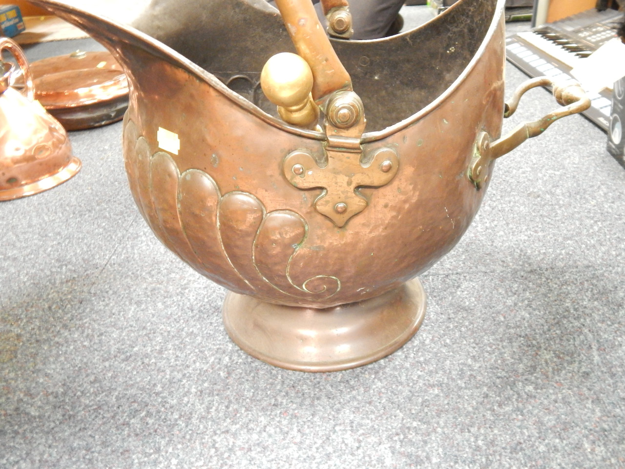 Appraisal: A Victorian embossed copper coal helmet