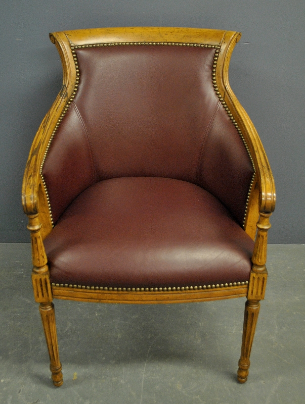 Appraisal: - Hancock Moore fruitwood and leather bergere h x w