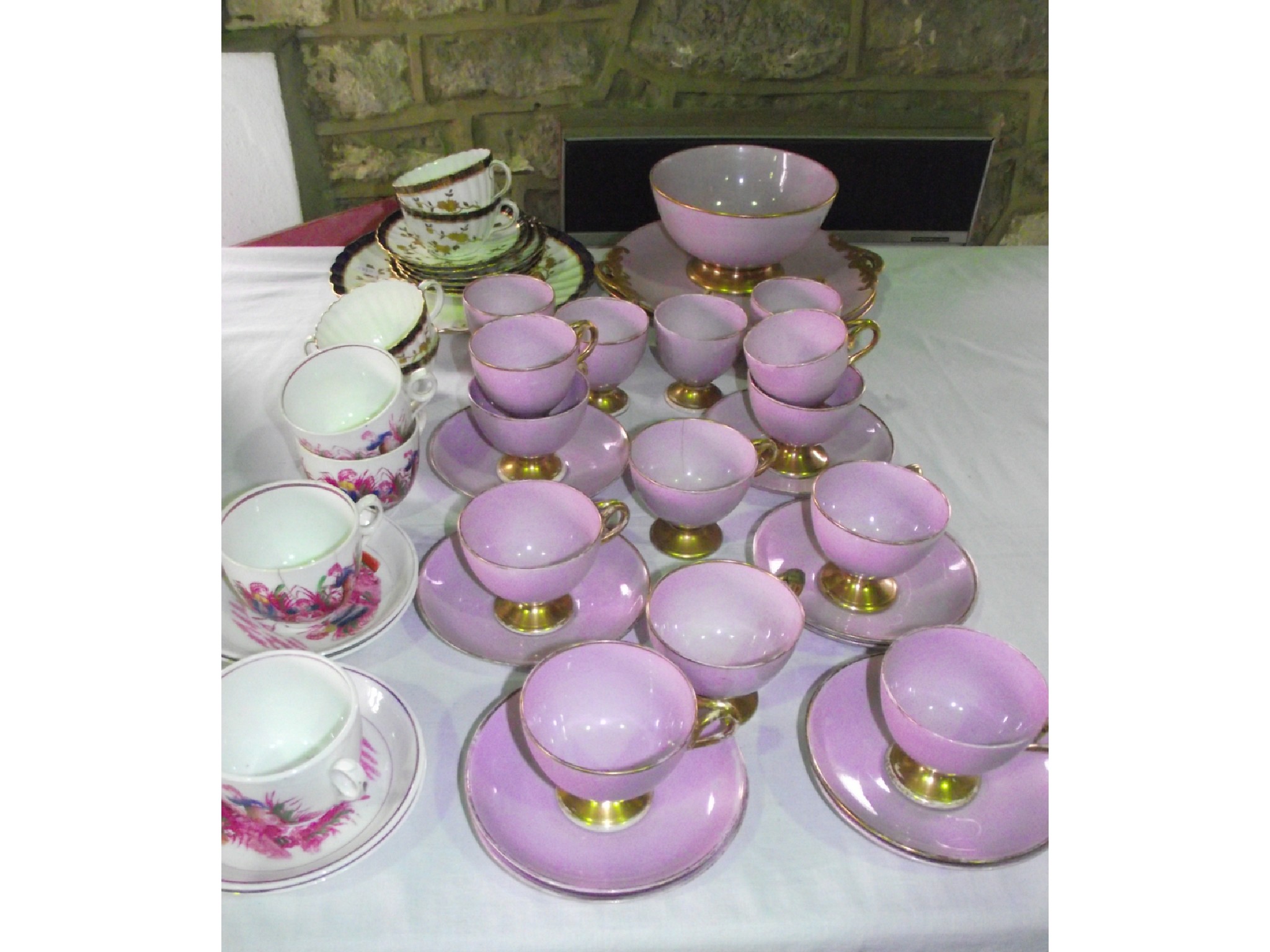 Appraisal: A quantity of late th century lilac ground tea and