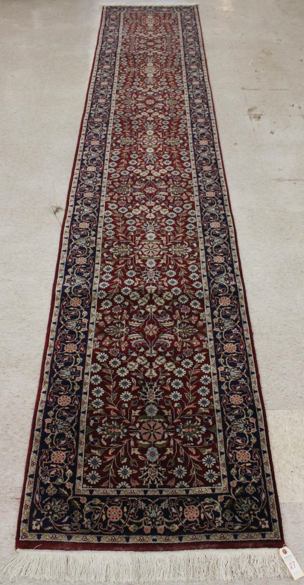 Appraisal: HAND KNOTTED ORIENTAL RUNNER Indo-Persian overall floral design on red