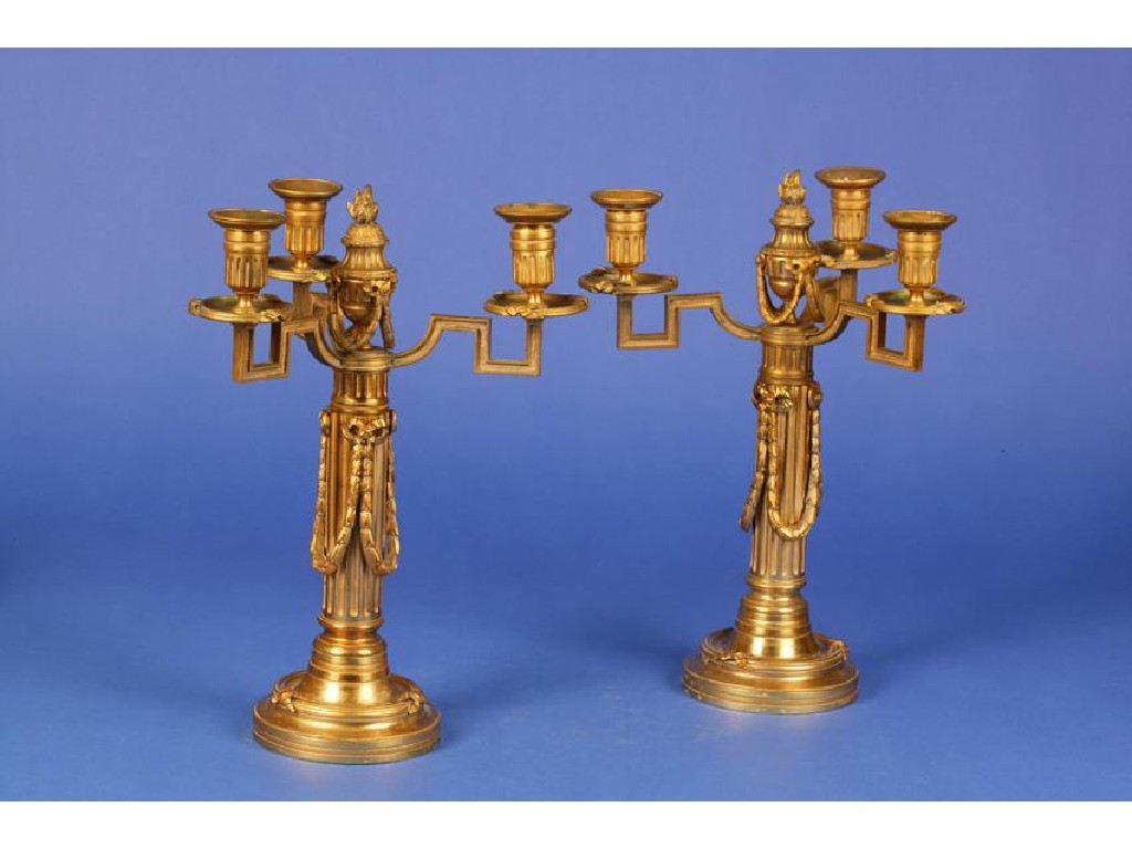 Appraisal: A PAIR OF LOUIS XVI STYLE ORMOLU CANDELABRA of neo-classical