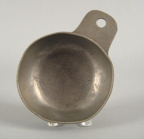 Appraisal: Pennsylvania tab handle pewter porringer early th c l dia