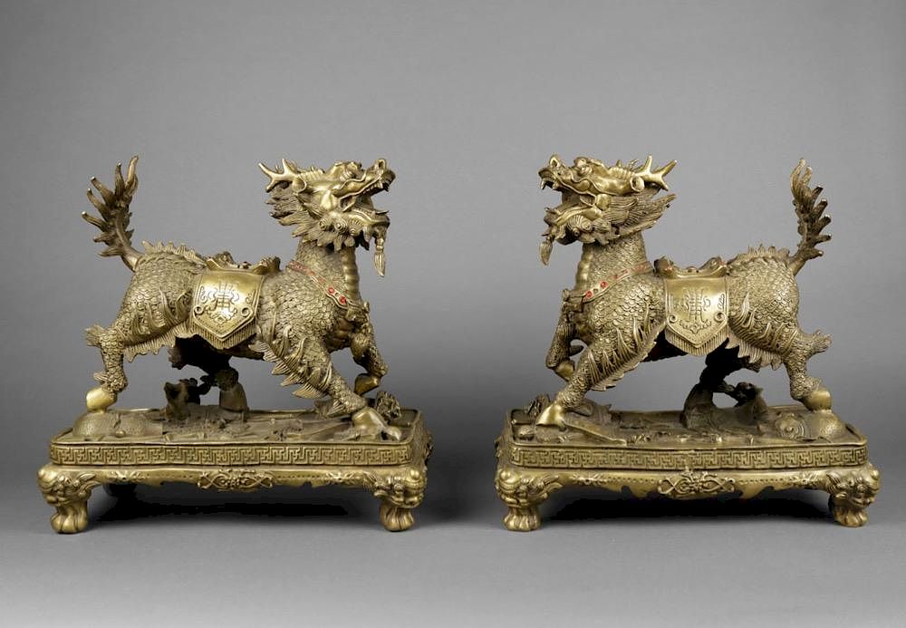 Appraisal: Pair of Chinese Brass Qilin figures ca Each raised on