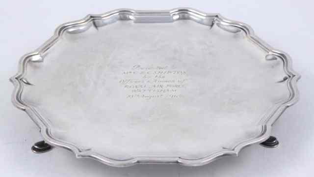 Appraisal: A silver waiter Sheffield with pie crust border and presentation