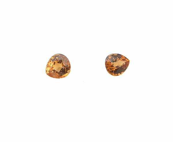 Appraisal: Two Orange Sapphires and Two Spessartite Garnets Two unmounted sapphires