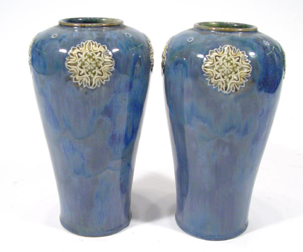 Appraisal: Pair of Royal Doulton stoneware vases with foliate mouldings onto