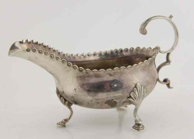 Appraisal: A George III silver sauce boat maker's mark rubbed London