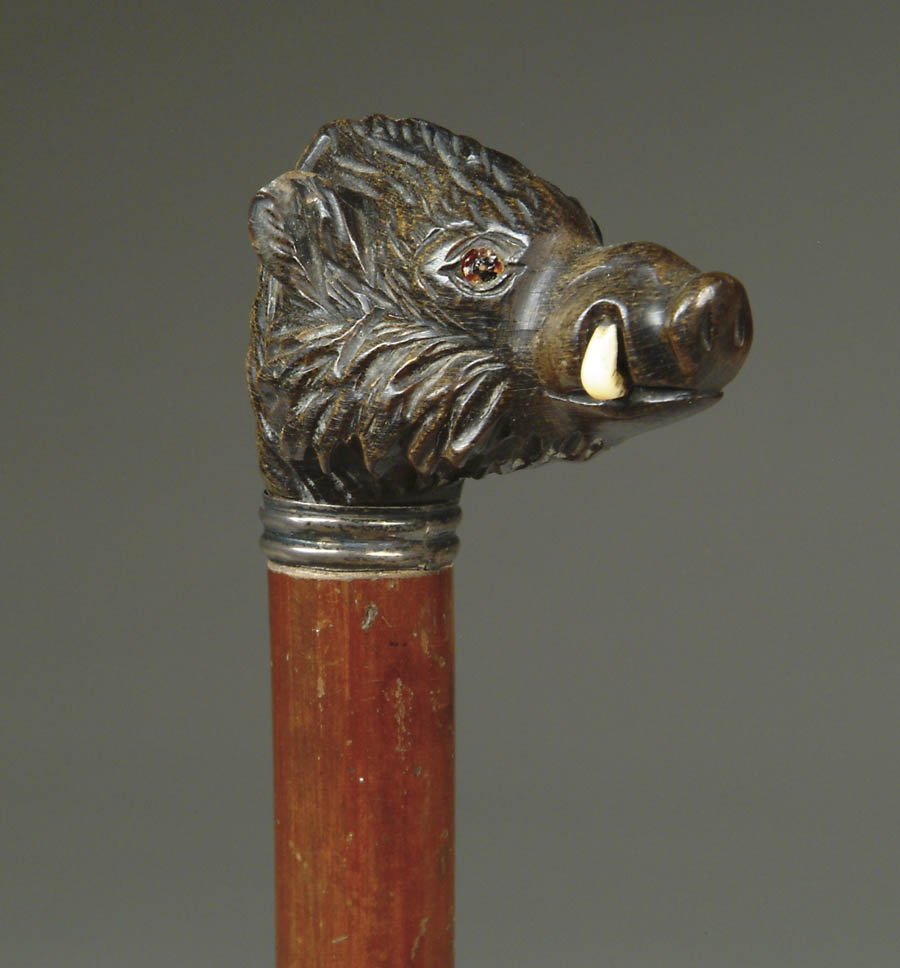 Appraisal: CARVED AND STAINED WOOD BOAR HEAD CANE Dark head having