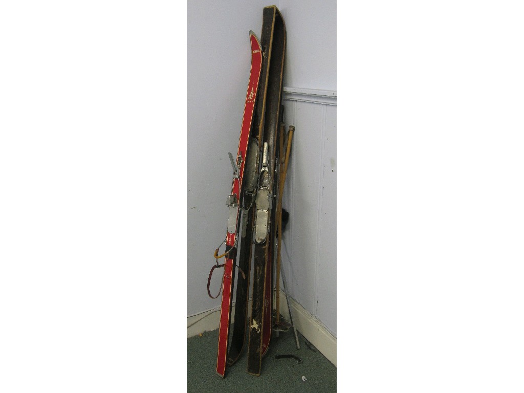 Appraisal: Lot comprising two sets of skis and poles