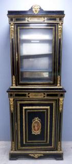 Appraisal: th century ebonised cabinet glazed door over cupboard door gilt