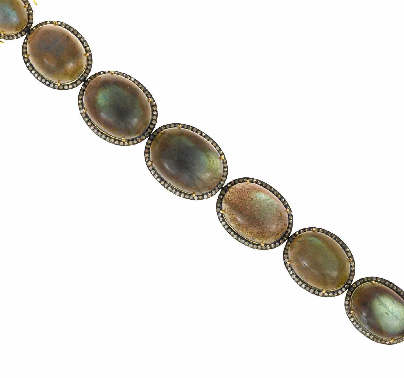 Appraisal: A labradorite and diamond bracelet composed of gradated oval-shaped labradorite