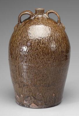 Appraisal: Georgia ovoid two-handle jug speckled and runny medium olive alkaline