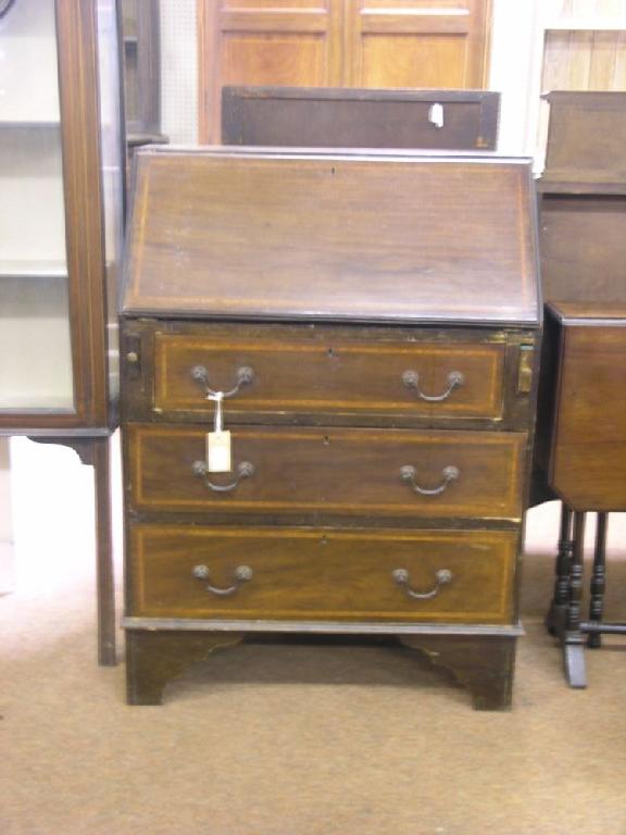 Appraisal: An Edwardian inlaid mahogany bureau fall front enclosing fittings above