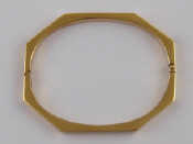 Appraisal: A yellow metal tests carat gold octagonal bangle approx mm