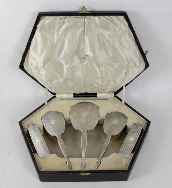 Appraisal: A silver backed five-piece dressing table set Walker Hall Birmingham