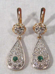 Appraisal: A pair of carat gold diamond and emerald drop earrings