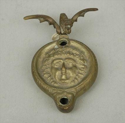 Appraisal: Brass Oil Light with Winged Serpent-Form Handle