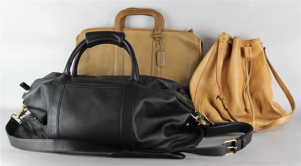 Appraisal: THREE COACH LEATHER BAGS including a pale brown duffle bag