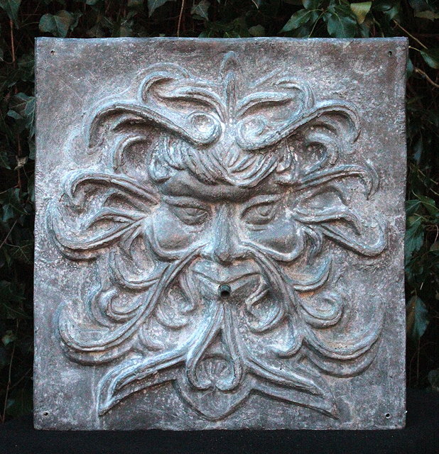 Appraisal: A LARGE LEAD GREEN MAN FOUNTAIN MASK with copper spout