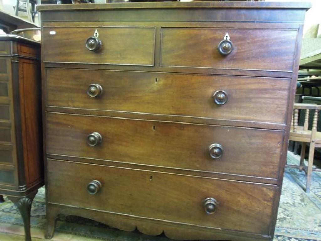 Appraisal: An early th century mahogany chest fitted with three long