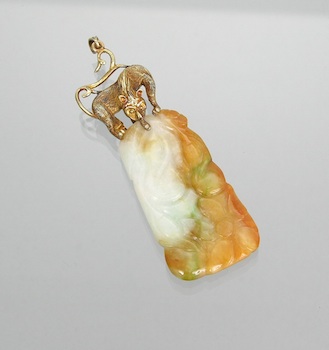 Appraisal: A Carved Jade and Gold Pendant Multi-color carved jade pendant