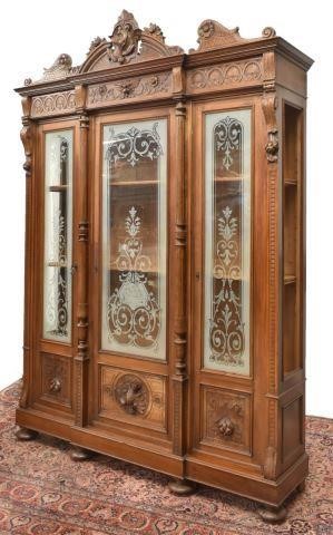 Appraisal: French carved walnut bookcase th c having a hunting dog