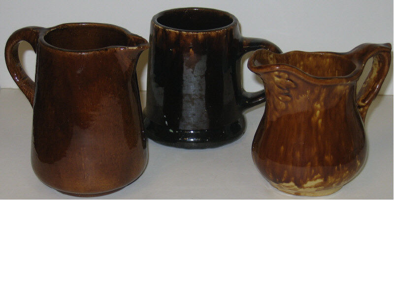 Appraisal: THREE PIECES OF BENNINGTON POTTERY Unmarked Yellowware having Rockingham glaze