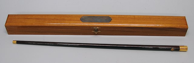 Appraisal: Swagger stick with gold plated end caps and applied Thai