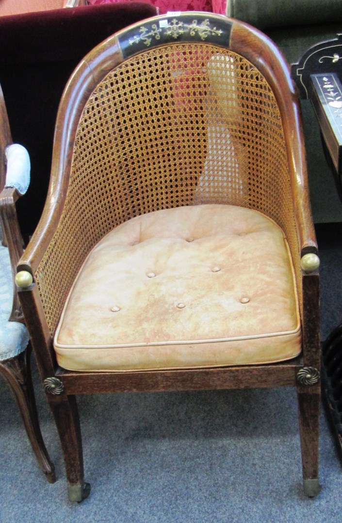 Appraisal: A Regency gilt metal mounted faux rosewood tub back library