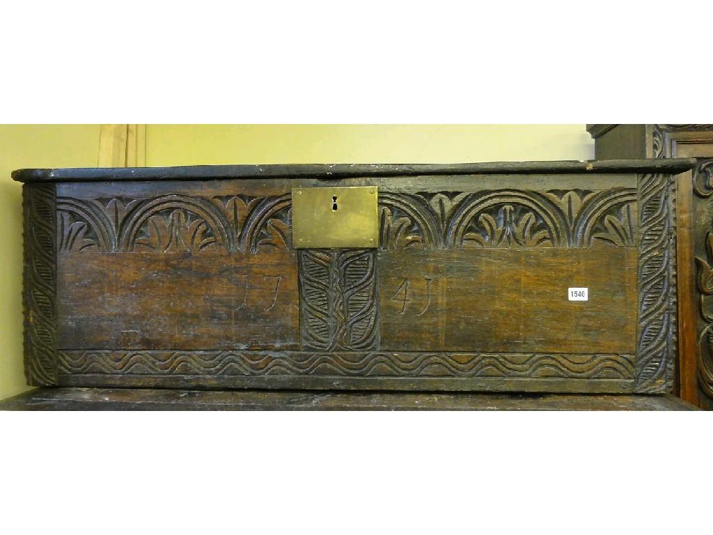 Appraisal: An antique oak six plank coffer with carved detail and