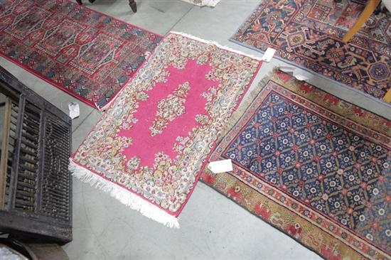 Appraisal: THREE ORIENTAL STYLE RUGS A runner having a blue ground