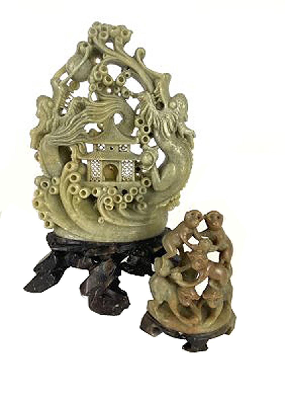 Appraisal: TWO CHINESE SOAPSTONE CARVINGSThe first a celadon carving with two