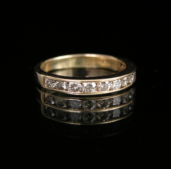 Appraisal: A Diamond Band in Gold k yellow gold band features