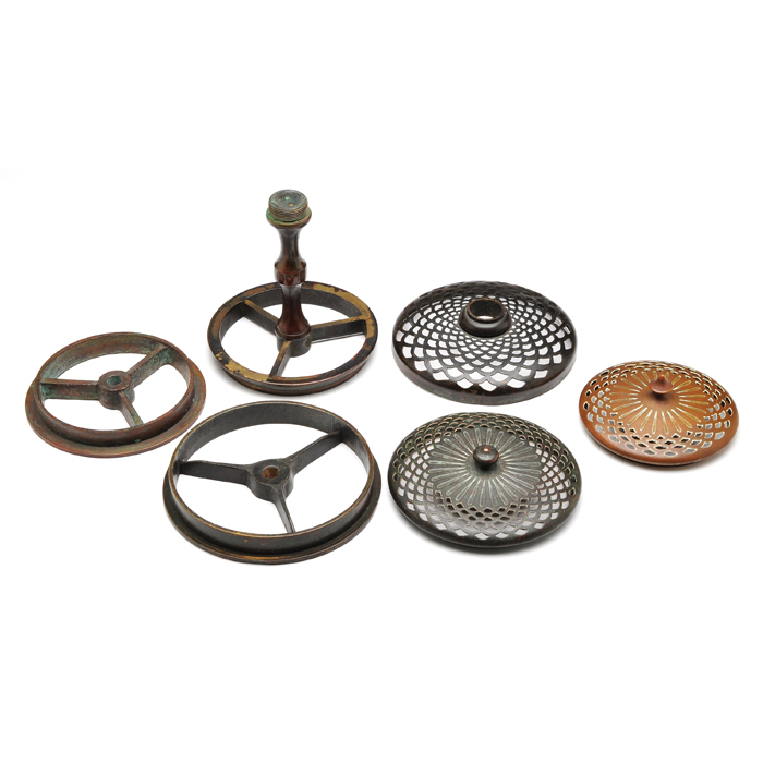 Appraisal: Tiffany Studios lamp parts three heat caps three risers bronze