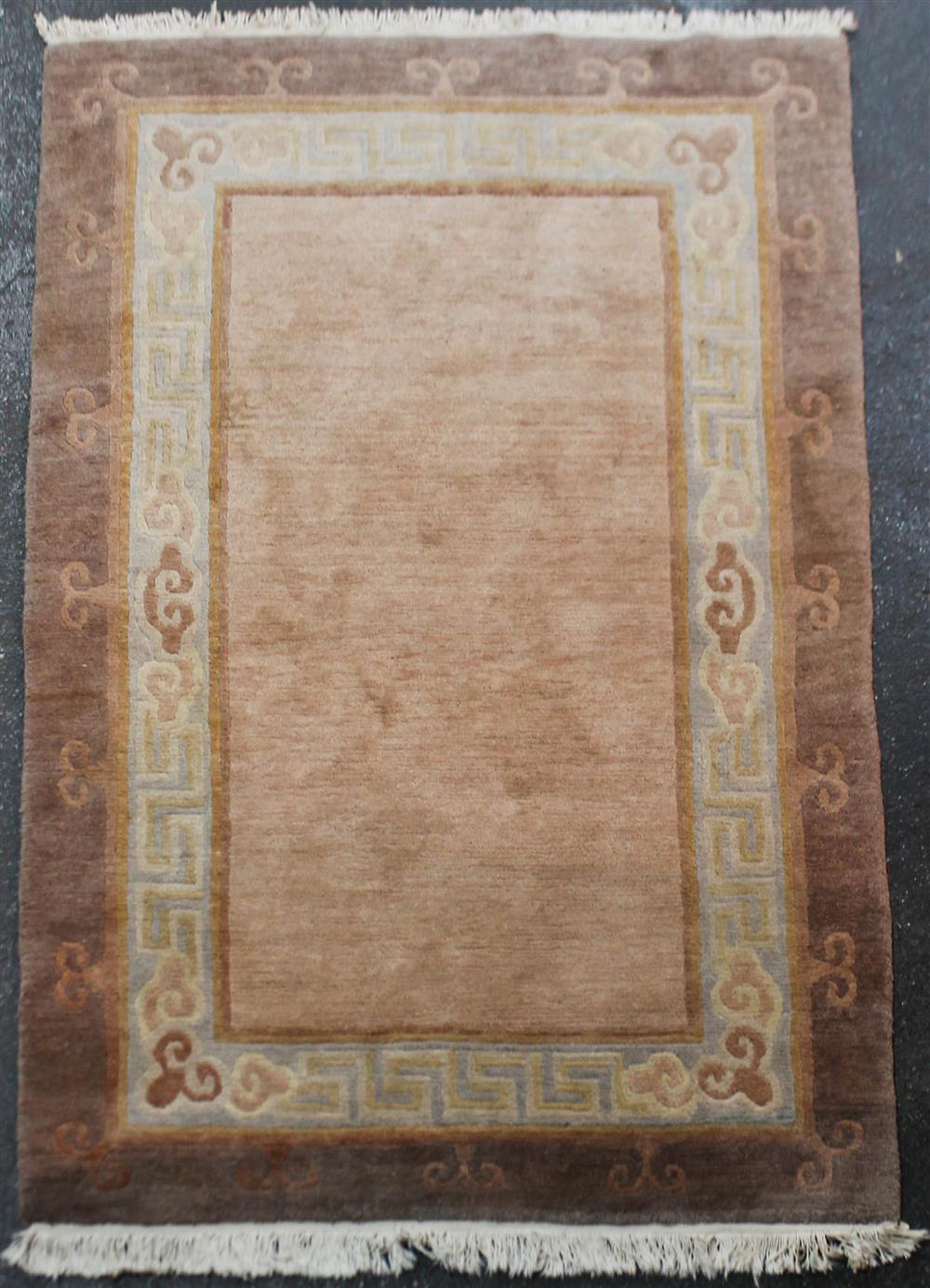 Appraisal: CHINESE WOOL RUG WITH BORDER DESIGN solid field with border