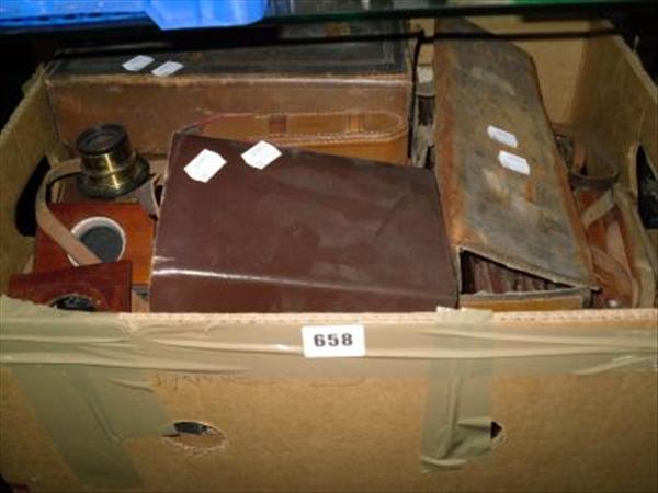 Appraisal: Two leather cased mahogany and brass plate cameras and various