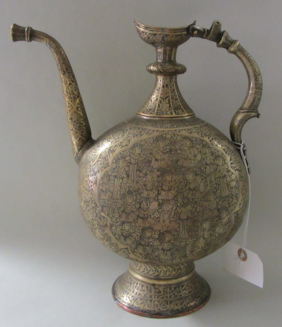 Appraisal: A Qajar brass ewer Iran th century the flattened globular