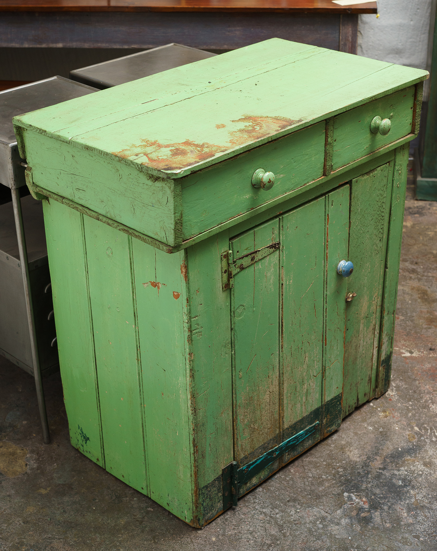 Appraisal: A DEPRESSION PERIOD SIDE CABINET Two drawers central cupboard distressed