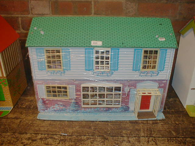 Appraisal: A tin plate dolls house and contents