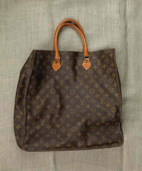 Appraisal: Louis Vuitton hand bag together with an eye glass case