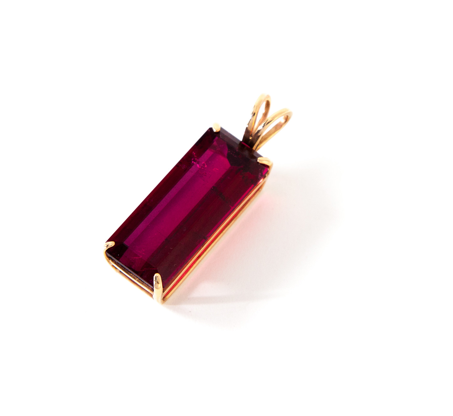 Appraisal: RUBY PENDANT American st century Stamped K yellow gold pendant