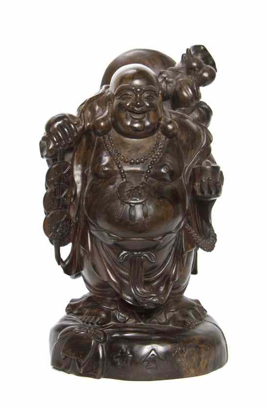 Appraisal: A Chinese Hardwood Carving of a Happy Buddha the figure