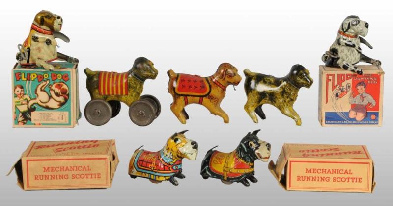 Appraisal: Lot of Tin Litho Dog Wind-Up Toys Description Working Toys