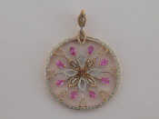 Appraisal: An carat gold pink sapphire and diamond flower pendant of