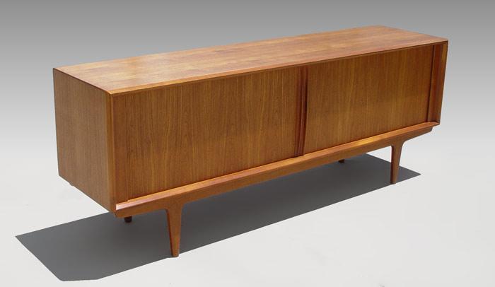 Appraisal: TAMBOUR DOOR DANISH MODERN SIDEBOARD Dual sliding tambour doors reveal