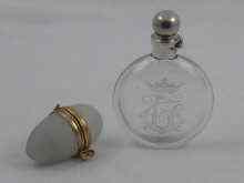 Appraisal: Two scent flasks one clear glass with engraved crowned monogram