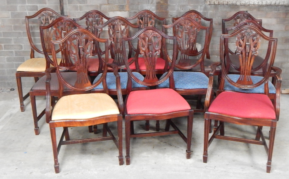 Appraisal: A set of twelve Hepplewhite design mahogany shield back boardroom