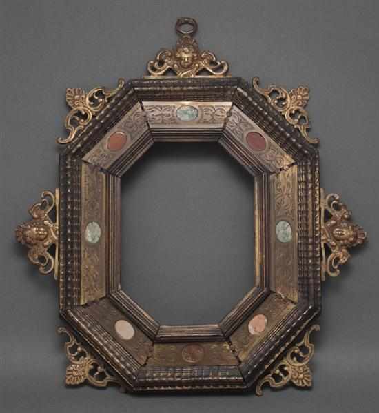 Appraisal: Italian cast and etched brass ebonized wood octagonal frame inset