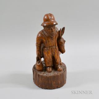 Appraisal: Carved Figure of a Miner and Mule th century ht