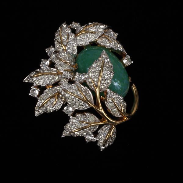 Appraisal: Jomaz gold tone pave floral pin brooch with Bohemian Jade